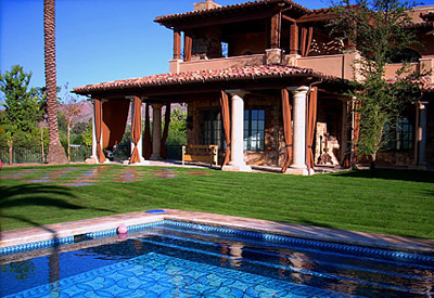 backyard with a pool and fresh sod from Evergreen Turf